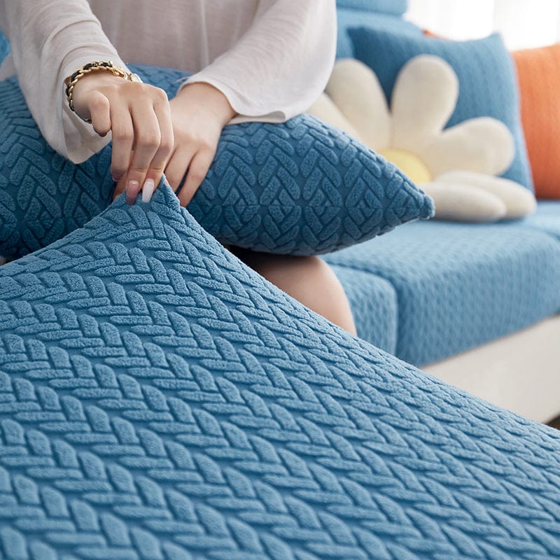 Housse polaire bleue avec motif laine sur canapé