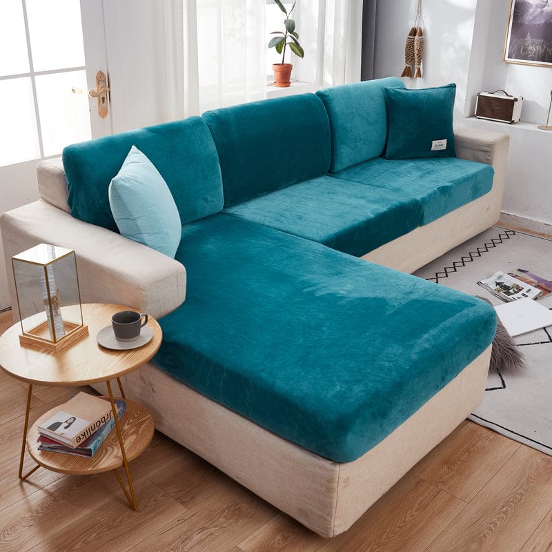 Housse en velours bleu turquoise sur canapé, texture douce