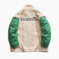 Blouson bicolore en fourrure avec manches vertes contrastantes