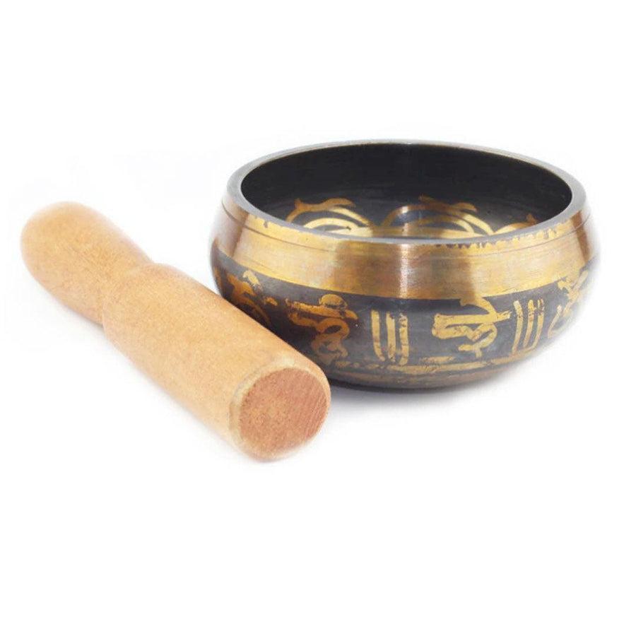 Bol chantant tibétain avec inscriptions dorées sur fond noir