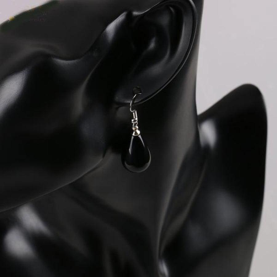 Boucles pendantes avec pierre améthyste et monture argentée