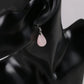Boucles pendantes avec cristal de roche et finition lisse