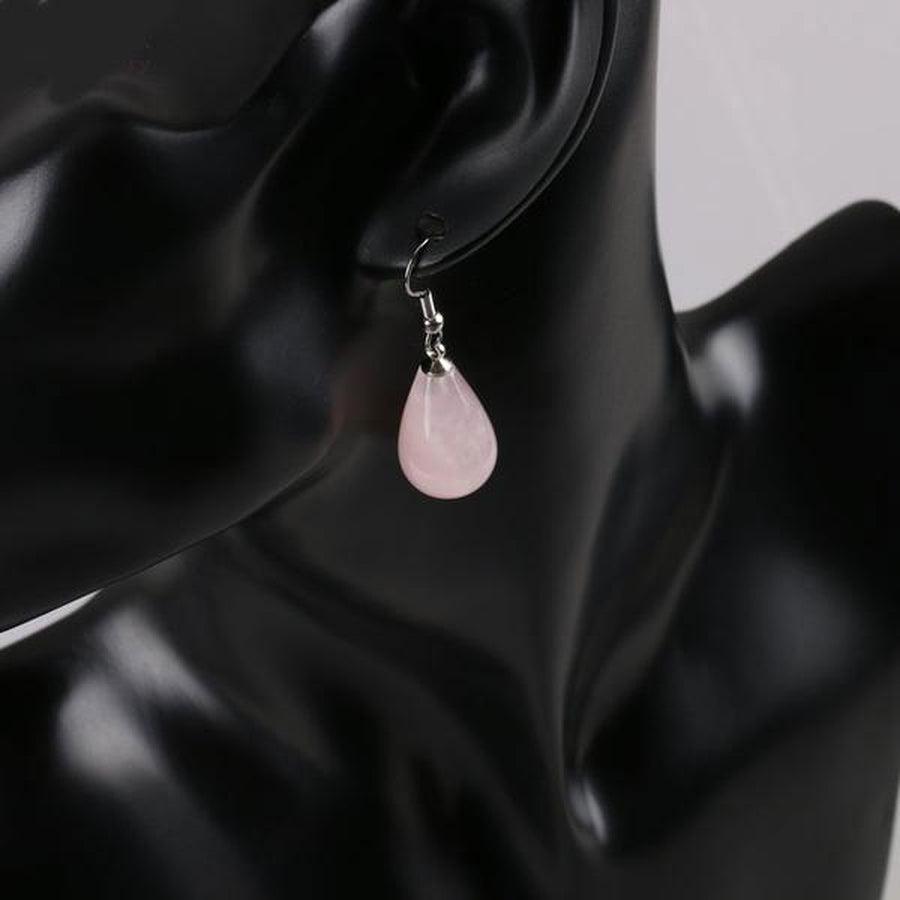 Boucles pendantes avec cristal de roche et finition lisse
