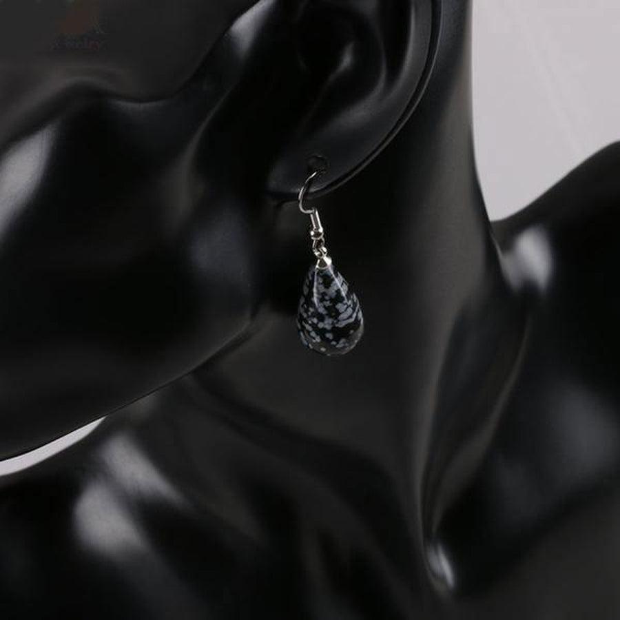 Boucles pendantes ornées de cristal de roche transparent