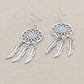 Boucles d'oreilles avec mandala et plumes suspendues