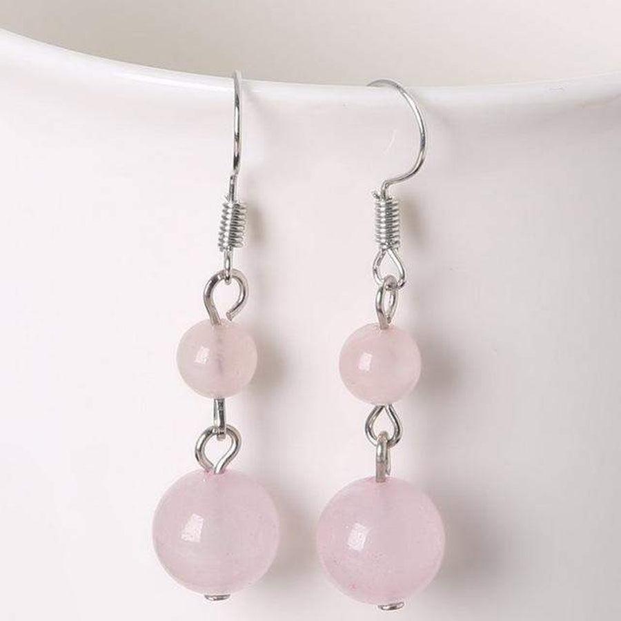 Boucles d'oreilles améthyste, contraste entre perles et crochets