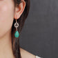 Boucles d'oreilles pendantes avec pierres vertes géométriques