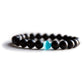 Bracelet en onyx et œil de chat sur fond blanc