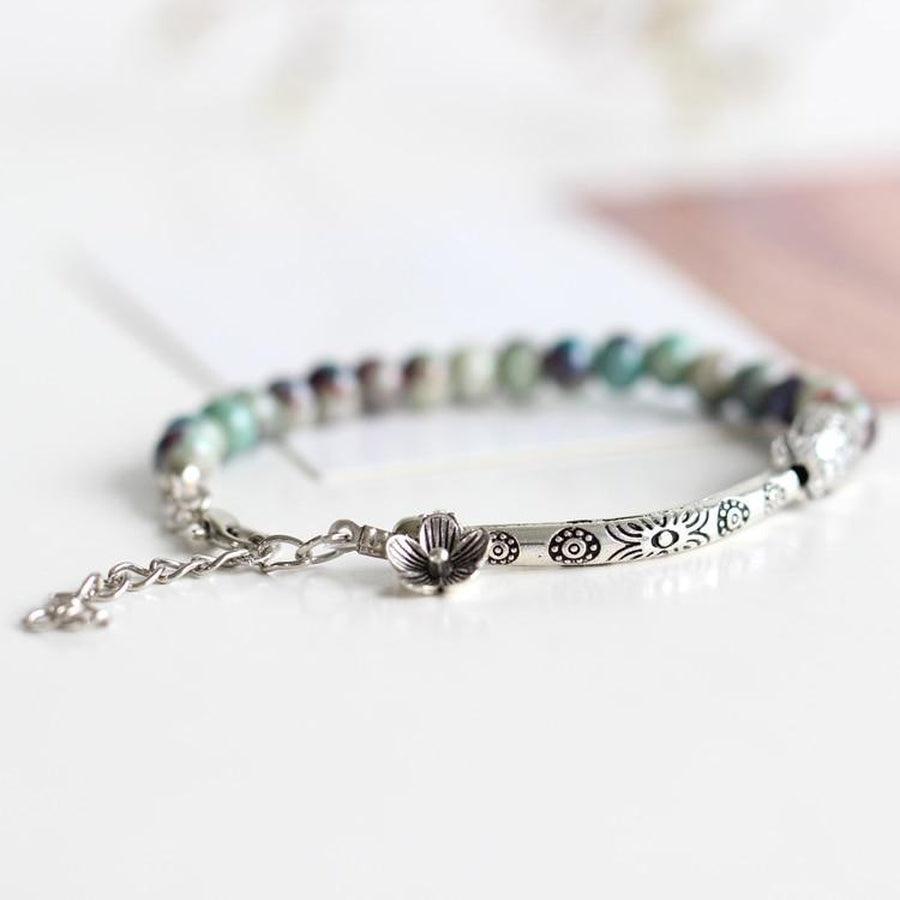 Bracelet artisanal en céramique avec motifs floraux