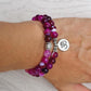 Bracelet onyx rose avec charme Om, vue latérale