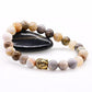 Bracelet en onyx avec tête de Bouddha dorée