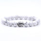 Perles naturelles montées sur bracelet avec tête de Bouddha