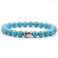 Perles naturelles sur bracelet, tête de Bouddha stylisée