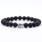 Détail d'un bracelet en pierres polies avec tête de Bouddha