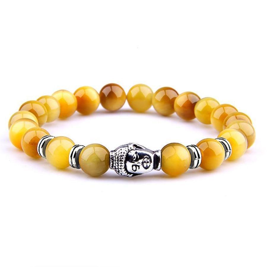 Gros plan sur perles œil de tigre jaune du bracelet