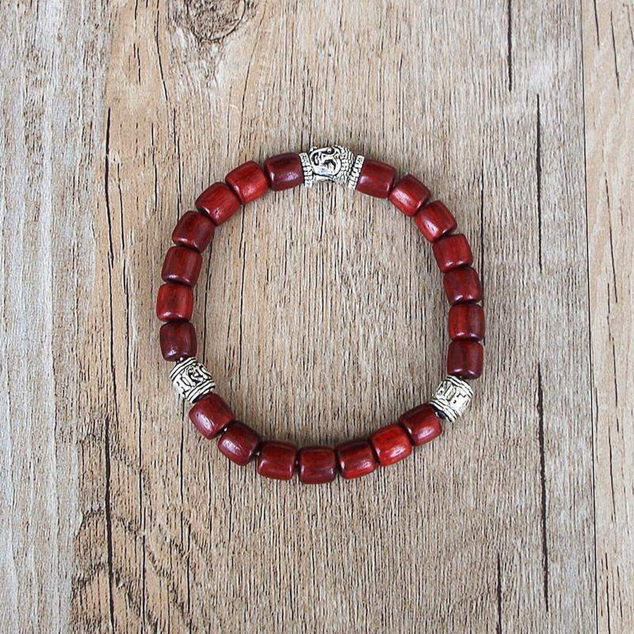 Bracelet en bois acajou avec tête de Bouddha en cuivre