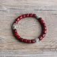 Bracelet élastique avec perles en bois et détails en cuivre