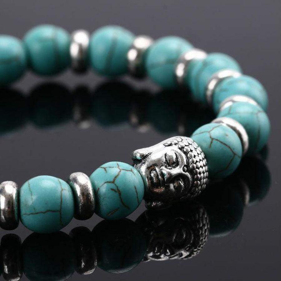 Bracelet avec perles marbrées et tête de Bouddha argentée