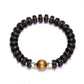 Bracelet avec perles coco gravées et œil de tigre central