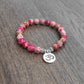 Bracelet agate rose, pendentif Om en alliage cuivre-zinc