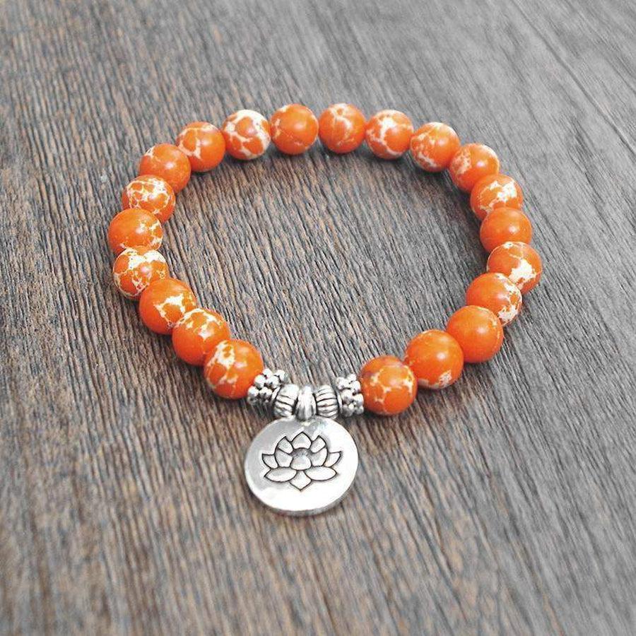 Bracelet en calcite orange avec pendentif lotus gravé