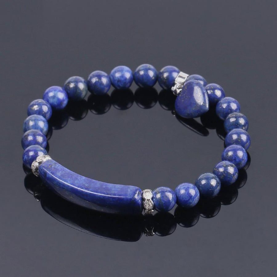 Bracelet avec perles rondes et petit cœur en pendentif