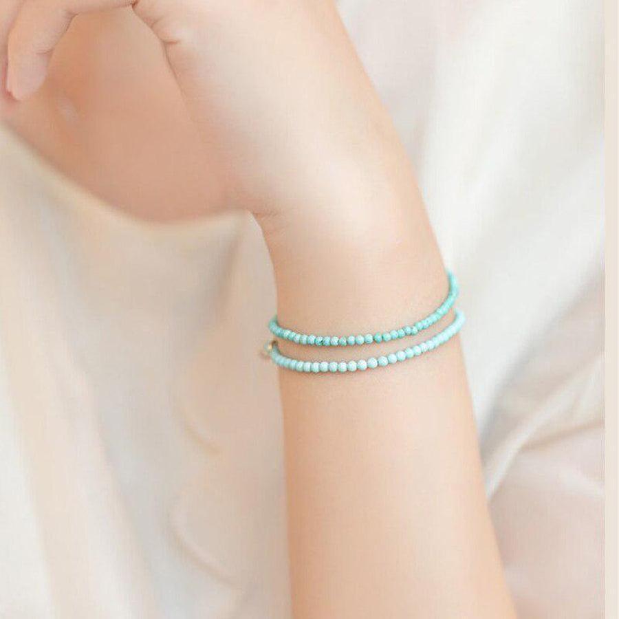 Bracelet turquoise avec fermoir rond doré