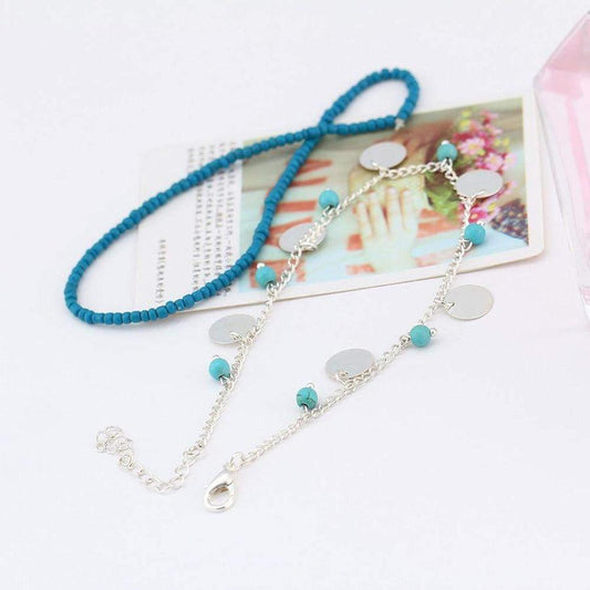Bracelet de cheville en perles turquoise et charms argentés
