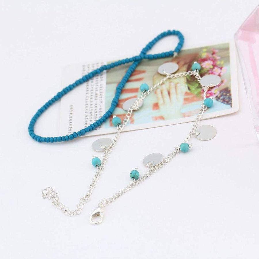 Bracelet de cheville en perles turquoise et charms argentés
