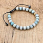 Bracelet en amazonite et hématite sur fond blanc