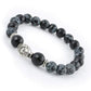 Bracelet avec tête de Bouddha en perles noires et dorées
