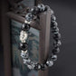 Vue latérale du bracelet Bouddha montrant les perles polies