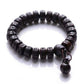 Bracelet en bois de pêcher avec perles sculptées
