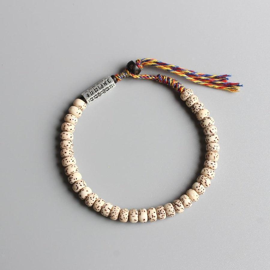 Bracelet en graines de Bodhi avec perle noire et mantra gravé