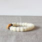 Détail des perles de noix de coco et graines de Bodhi