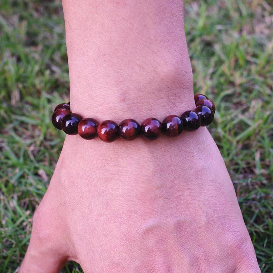 Bracelet en perles Œil de tigre rouge sur fond blanc