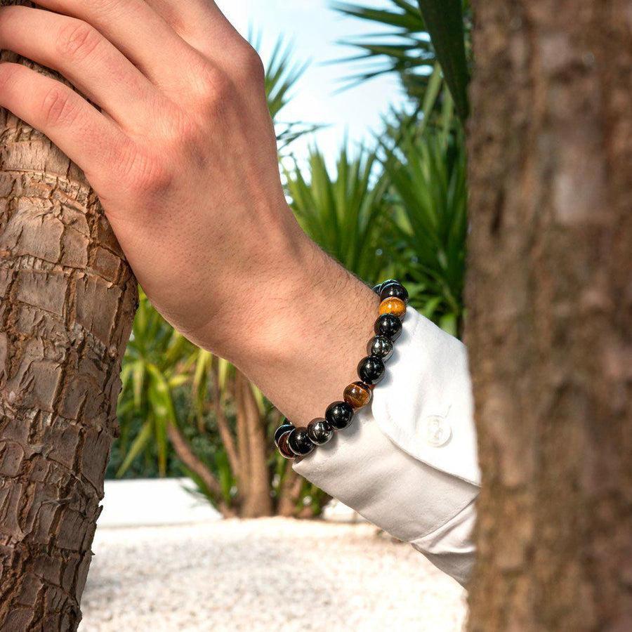 Détail des perles de 10 mm en obsidienne et œil de tigre