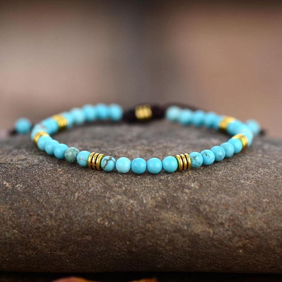 Bracelet tressé avec perles turquoise et dorées, nœud coulissant