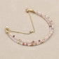 Bracelet double rangs en cristal rose et perles dorées