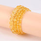 Gros plan sur les perles de citrine du bracelet
