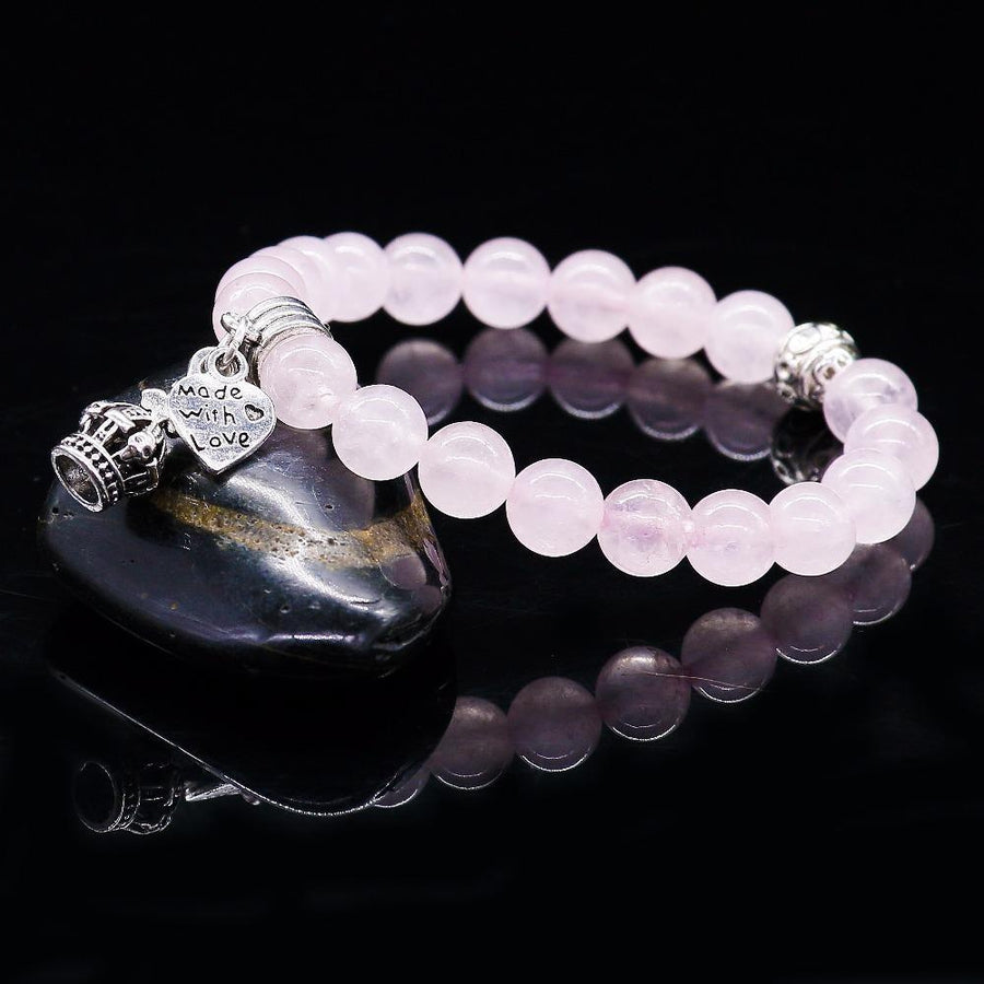 Bracelet en cristal rose avec pendentif cœur argenté