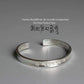 Bracelet ajustable en cuivre blanc avec inscriptions bouddhiques