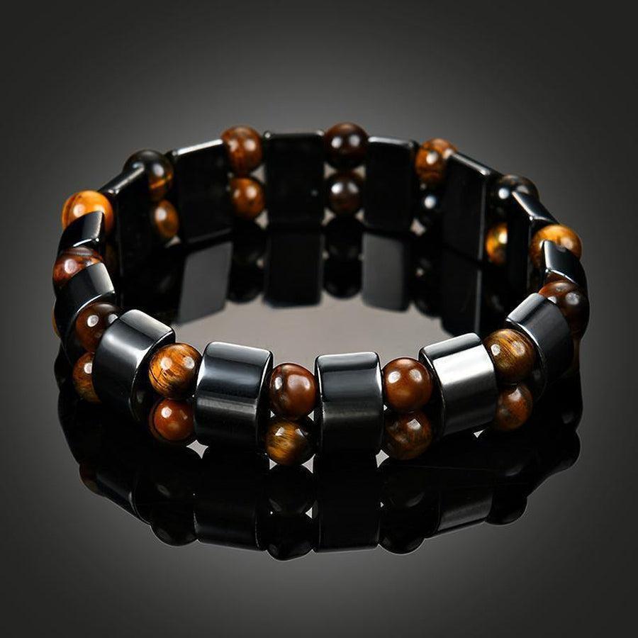 Bracelet élégant en hématite et œil de tigre sur surface claire