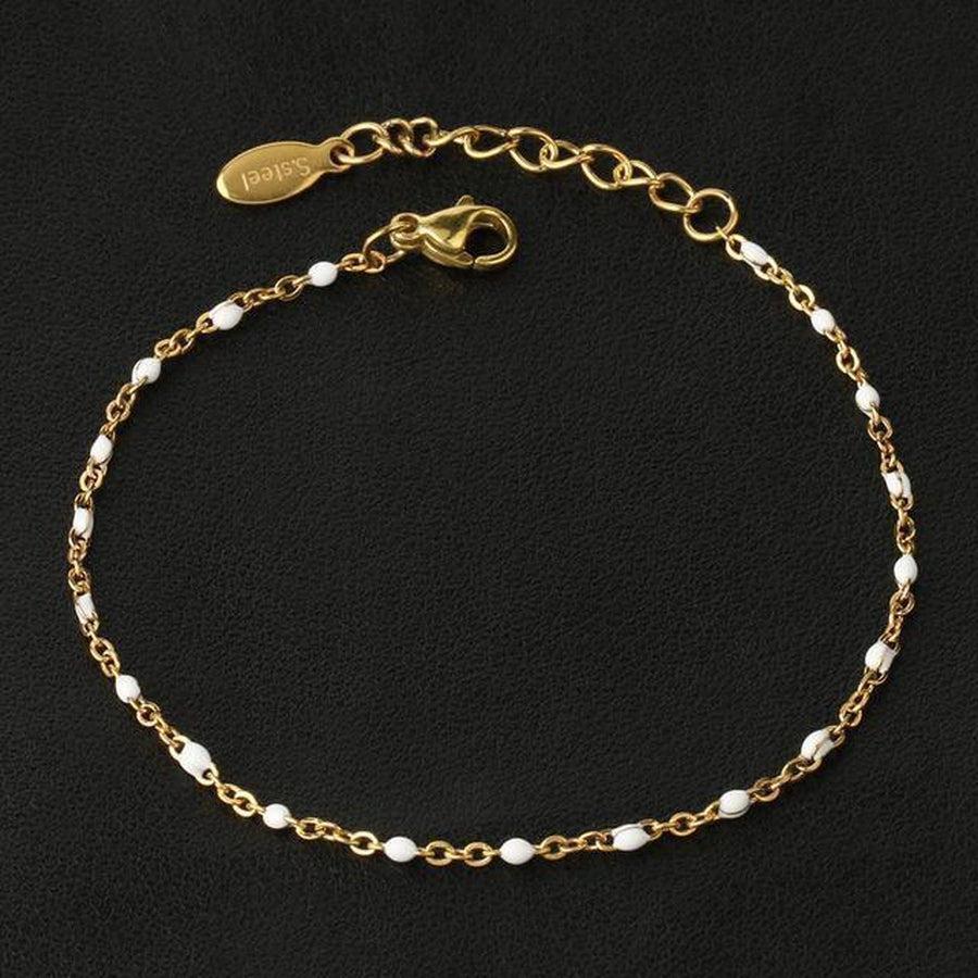 Bracelet en perles fines, fermoir et chaînette visibles