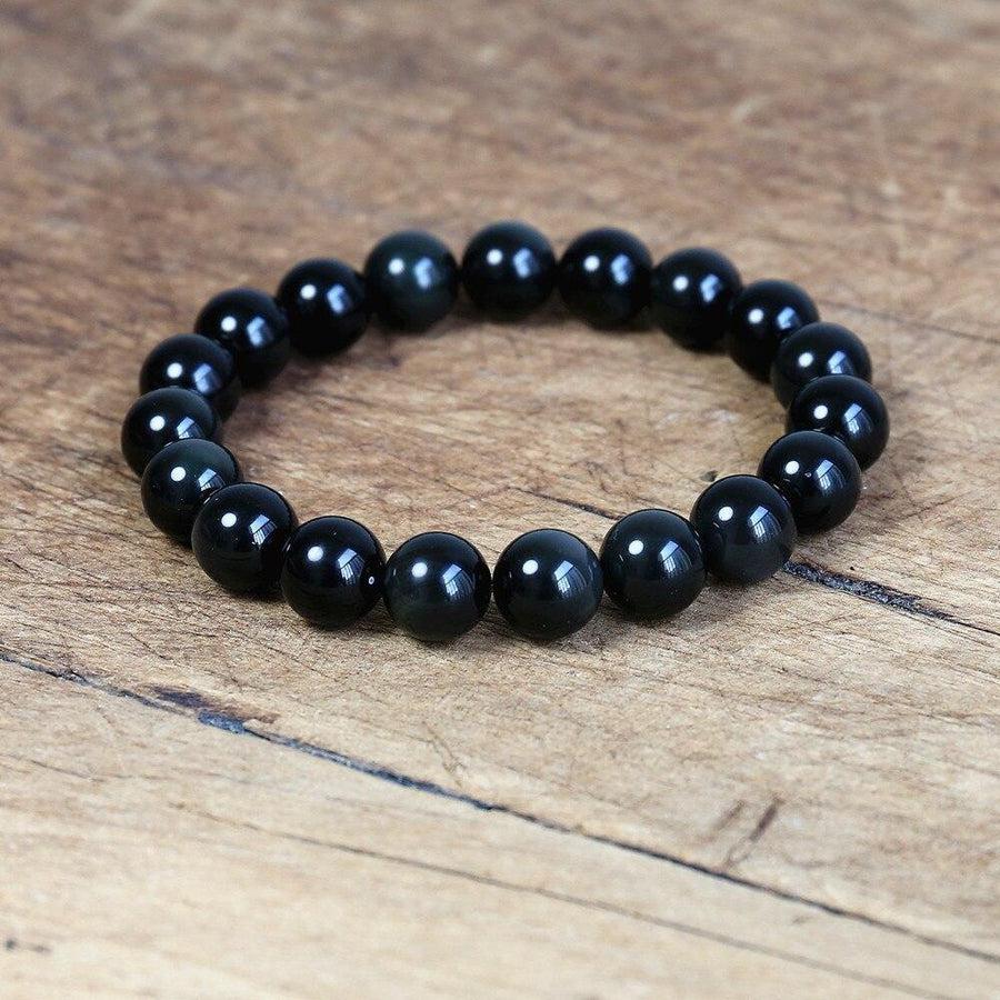 Bracelet en obsidienne noire sur fond blanc, perles lisses