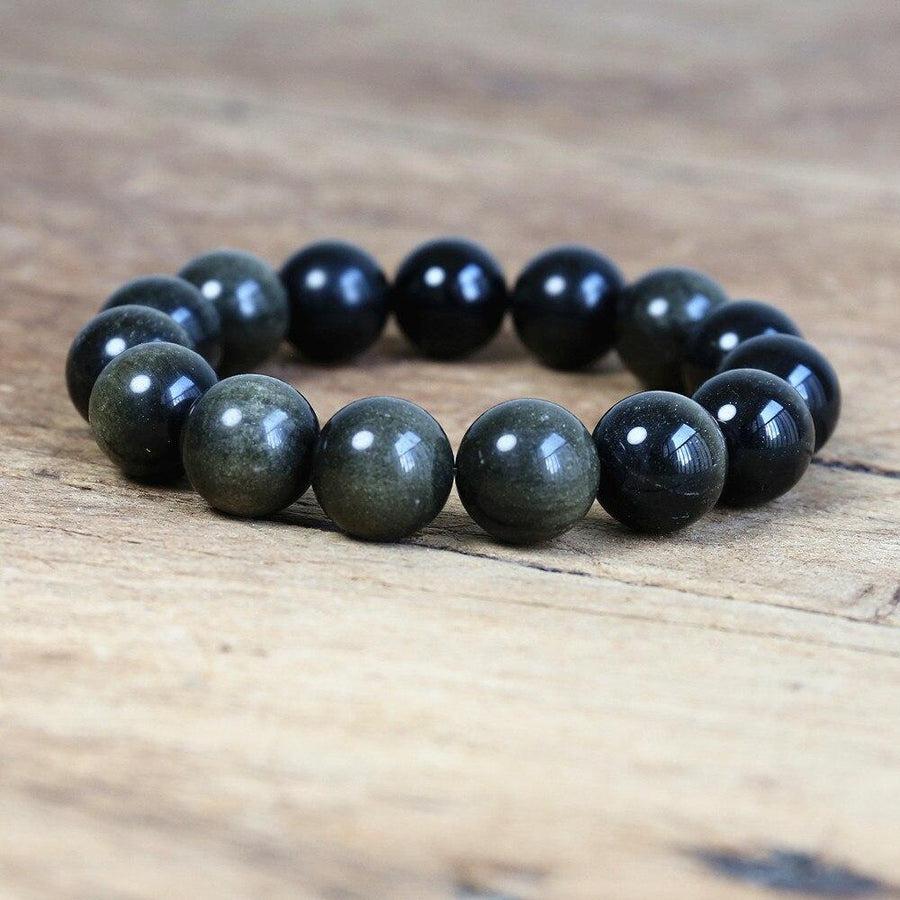 Bracelet en obsidienne noire dorée sur fond blanc