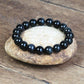 Vue rapprochée du bracelet obsidienne noire, perles uniformes