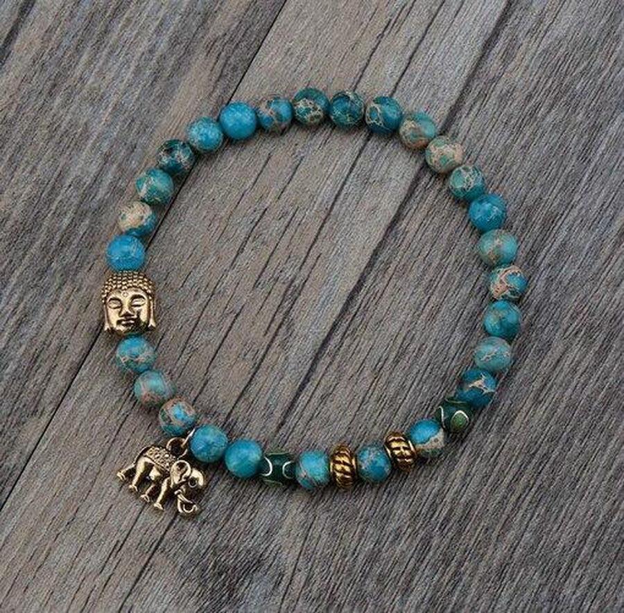 Bracelet en perles de turquoise avec symbole Bouddha