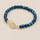Bracelet en perles d'œil de tigre bleu avec fermoir cœur en cuivre