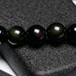 Bracelet obsidienne avec perles et symbole Om sur fond clair